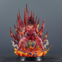 Figurine dragon ball rouge et or de goku en posture de combat avec effets énergétiques pour guerrier puissant 38 cm