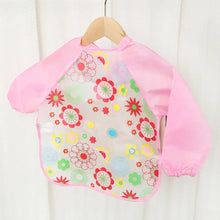 Bavoir tablier à manches longues pour enfant en tissu rose à motifs floraux avec panneau central transparent