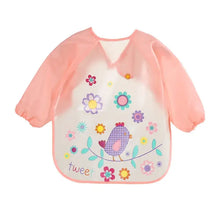 Bavoir tablier à manches longues rose avec panneau transparent orné d un oiseau violet à carreaux et fleurs colorées