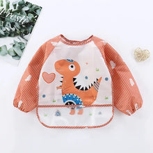 Bavoir tablier à manches longues orange et blanc rayé avec motif dinosaure et panneau avant transparent pour enfant