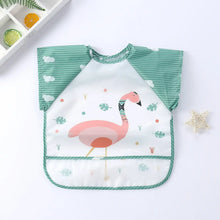 Bavoir tablier à manches longues blanc et bleu avec motif flamant rose et feuilles vertes pour enfant