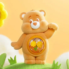 Figurine nounours câlin tan beige avec fenêtre ronde affichant tournesols souriants et paillettes boîte mystère pop mart