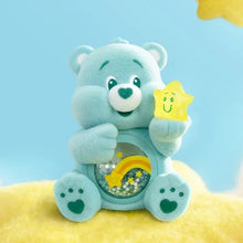 Une boîte mystère figurines nounours câlin pop mart avec un nounours câlin bleu clair tenant une étoile jaune souriante en peluche