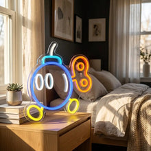 Lampe néon bombe rétro avec contours lumineux bleu orange et jaune en forme de personnage cartoon pour décoration gaming