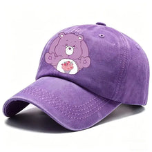Casquette care bears en suédine violette avec personnage care bears tenant un cupcake rose en style baseball ajustable
