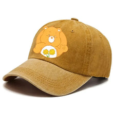 Casquette care bears ajustable en velours côtelé beige avec un care bear orange tenant des fleurs jaunes sur le ventre
