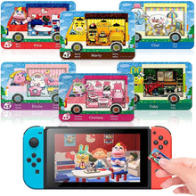 Console Nintendo switch avec joy-con rouge et bleu affichant une scène animal crossing pour cartes NFC collection animal crossing