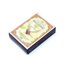 Élégant coffret noir et or cartes oracle Belline avec dessin orné et oiseau blanc en vol pour déguisement carnaval