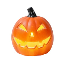 Citrouille lumineuse halloween en plastique orange avec tige noire et intérieur jaune lumineux décorative