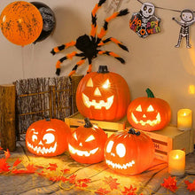 Citrouille lumineuse halloween décorative orange avec expressions sculptées et intérieur lumineux pour décoration festive