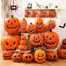 Orange citrouille lumineuse décorative en plastique avec visage sculpté et tiges noires pour halloween