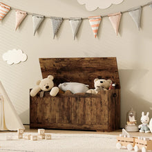 Rustic brown wooden coffre de rangement banc enfant with weathered finish and stuffed bears inside visible grain texture