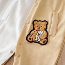 Combinaison bébé garçon beige en velours côtelé avec patch brodé doux dours tenant un chiot blanc