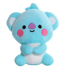 Peluche compagnon pop bleu en peluche avec joues roses nez violet et oreilles blanches assise en tailleur