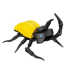 Construction lego moc insecte en plastique jaune et noir avec détail bleu circulaire sur la tête