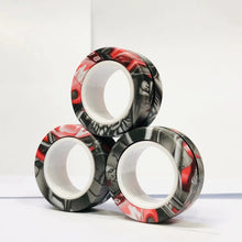 Lot de 3 anneaux magnétiques à manipuler avec design graffiti rouge et noir en surface brillante circulaire