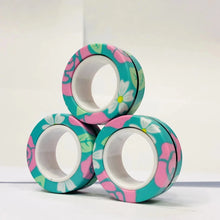 Lot de 3 anneaux magnétiques à manipuler en motif floral teal rose et blanc empilés en pyramide