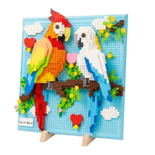 Tableau perroquets en construction 3d avec perruches rouges et blanches en briques plastiques pour déguisement carnaval