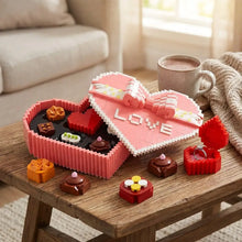 Boite de chocolats décoratifs jeu de construction en forme de cœur rose avec inscription love et ruban rayé cadeau romantique