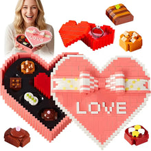 Boite de construction rose en forme de coeur avec noeud blanc et chocolats décoratifs idéale cadeau romantique carnaval
