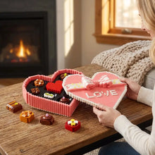 Jeu de construction boite chocolat en lego rose avec ruban blanc et chocolats décoratifs idéal cadeau romantique