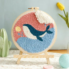 Kit de broderie punch needle avec motif de baleine bleue sur vagues roses et bleues en broderie punch textured