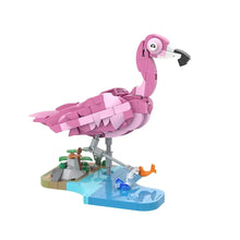 Jeu de construction flamant rose en briques plastique rose avec île miniature et feuillage vert 287 pièces