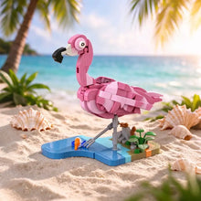 Jeu de construction flamant rose 287 pièces modèle vibrant rose en lego avec bec noir et œil blanc sur plage sableuse