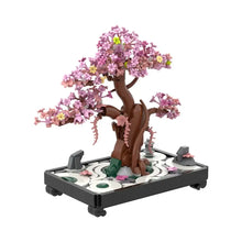 Jeu de construction fleurs en pot avec arbre cerisier rose violet tronc brun feuilles vertes et lanterne pierre modèle décoratif
