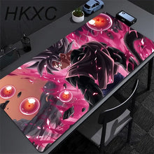 Tapis de souris grand format manga maîtres des arts martiaux avec goku super saiyan rose et noir énergisé