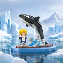 Jeu de construction orque de 758 pièces avec orque noir et blanc sautant sur une plateforme glacée bleu ciel