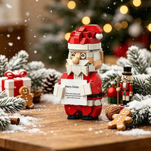 Figurine construction personnage noël portant rouge et blanc en plastique abs tenant une pancarte merry christ