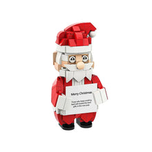 Jeu de construction personnage de Noël en plastique abs rouge et blanc tenant une pancarte merry christmas