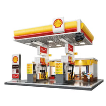 Modèle station d’essence shell v-power jaune et rouge en lego avec nombreux éléments pour jeux de construction station d’essence led