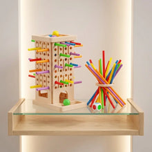 Jeu d’équilibre avec bâtonnets en bois colorés comprenant des tranches d’âge indiquées pour enfants