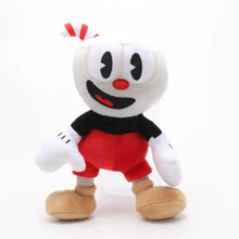 Peluche héros à tête blanche avec yeux noirs, nez et bouche rouges, portant un t-shirt noir et short rouge, 25 cm