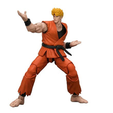 Figurine équipe arts martiaux 1 18 tenue orange avec ceinture noire et sculpt détaillé en position de combat
