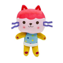 Peluches chats avec tête rose, visage blanc, membres jaunes et robe à pois bleus dans univers félin enchanté maison enchantée