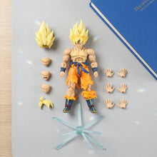 Figurine dragon ball z super saiyan goku avec cheveux jaunes, musculature détaillée, pièces interchangeables, orange et bleu