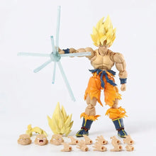 Figurine dragon ball z super saiyan goku en tenue orange avec botte bleue tenant une arme étoile translucide