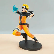 Figurine naruto shippuden battle 19cm orange et noir en pose dynamique avec énergie chakra bleu