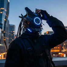 Masque futuriste lumineux noir avec lumières bleues circulaires et accents métalliques angulaires pour halloween