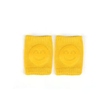 Genouillères souples pour bébé 8 × 11 cm en tricot jaune avec smiley en relief parfait pour déguisement carnaval