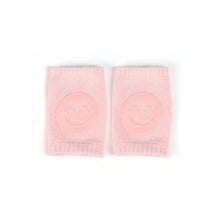 Genouillères souples bébé rose en tricot avec smiley brodé dimensions annoncées 8 × 11 cm parfait pour déguisement carnaval