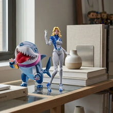 Figurines super heros rivals à construire avec figurine en armure bleue et blanche à cheveux blonds et requin bleu rose modèle kit rivals