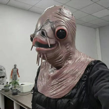 Masque intégral monstre poisson en latex rose texturé avec grands yeux noirs cerclés de rouge et tentacules pour halloween
