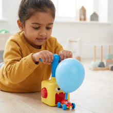 Pompe à ballon rouge et jaune avec poignée et base bleues et visage souriant pour jouet ballon air comprimé enfant