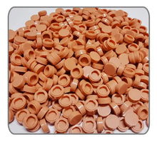 Une pile de briques en plastique tan avec finition brillante et indentations circulaires pour lego moc carrelage 1000pcs