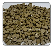 A pile of tan plastic lego moc carrelage round caps in a 1000pcs set for moc carrelage projects
