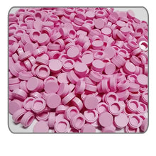 Une pile de 1000 connecteurs ronds lego moc carrelage en plastique rose pour construction moc carrelage